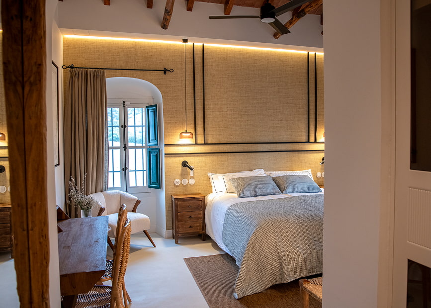 Room with double bed and designer furnishings