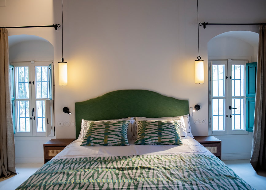 Front view of King Size Bed with upholstered headboard with green printed fabric